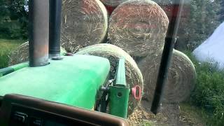 Unloading and Stacking Hay Bales
