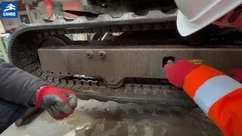 How to correctly tension a rubber track using the Camso tension wedge ?