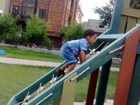 Qasim dawood in Park taking slide