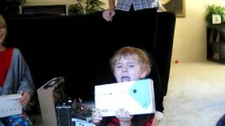 Kid opens Nintendo DSI on Christmas