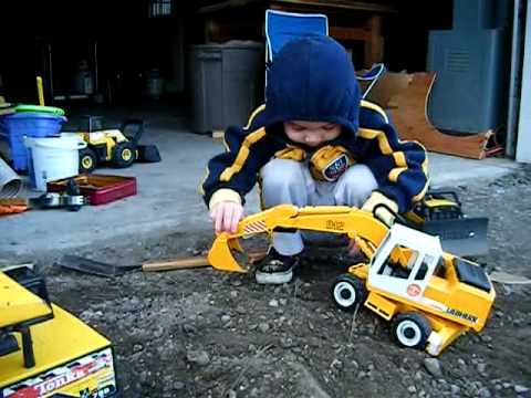 kids playing with toy trucks