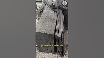 The stonemason used a thin chisel to chisel the gray black shale into thin tiles