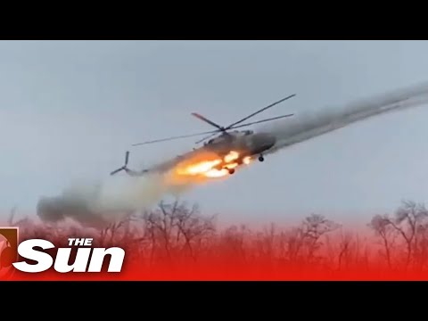 Ukrainian combat helicopter fires missiles at Russian positions.