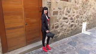 Victoria Devil. Elegant outfit walking in public. Red leather top,shiny black leggings and red heels