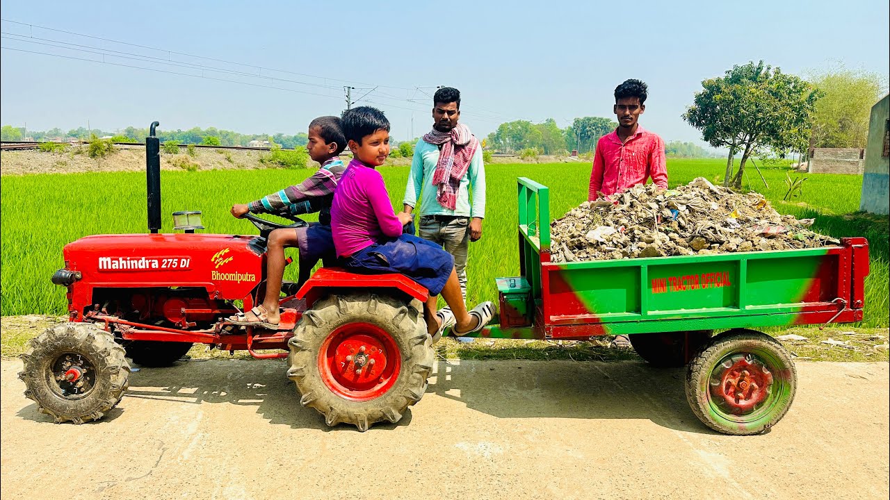 We Loader a Trolley of Over Load Soil Onto the Mini Tractor and Drove it down the Road