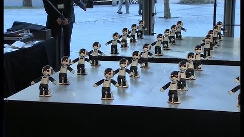 Watch 100 mini robots perform a synchronized dance