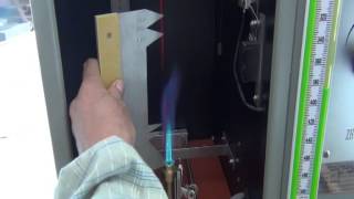 Single vertical insulated wire flame chamber tester