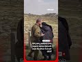 جندي إسرائيلي يحتجز راعي ا فلسطيني ا
