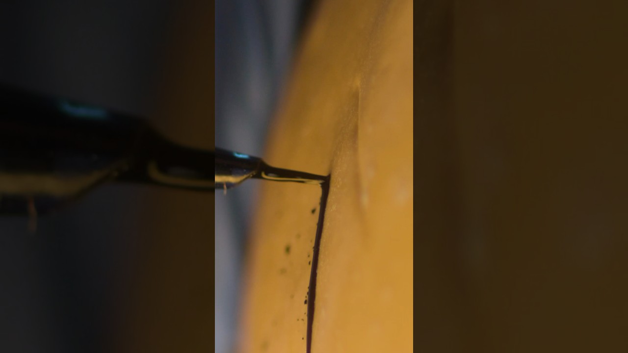 Close up: tattooing a pumpkin 