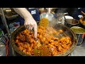 A large pot of Spanish Paella in Ruifeng Night Market