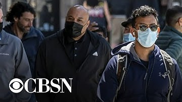 World Health Organization urges fully vaccinated people to continue wearing masks