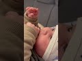 The baby is licking his/her finger.”