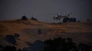 8-18-20 Fire at 8 mi on Mines Rd, Copter 106 from Cal Fire dropping water