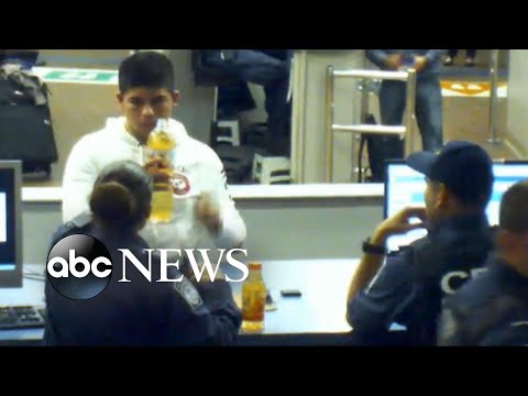 Two officers allow a teen to drink substance at the Mexican border