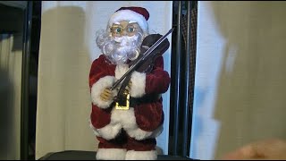 Rocking Santa Claus with a violin