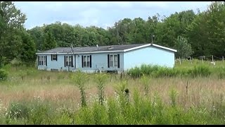 Abandoned Double wide Mobile Home with huge Pond