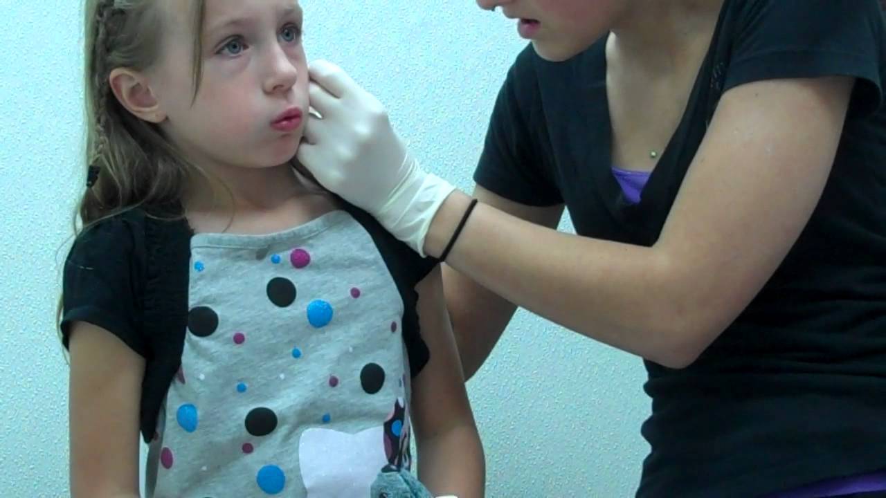 6 year old getting ears pierced using needle method YouTube