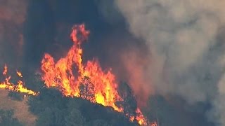 Dozens of homes burn in California wildfires