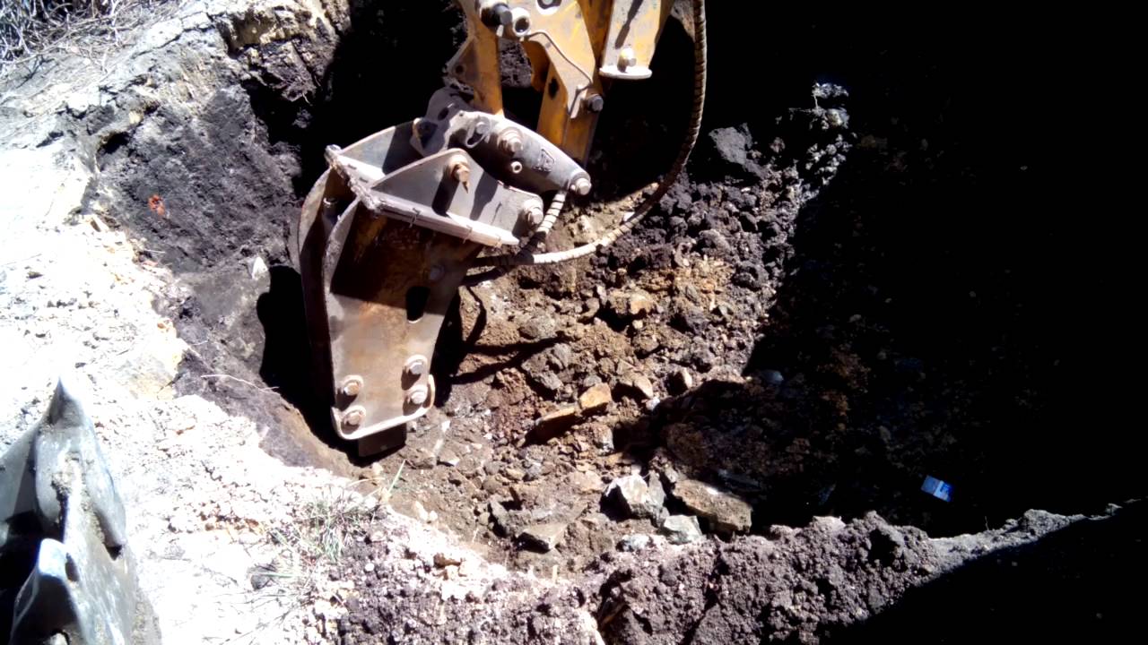 Как выкопать яму в скальном грунте - фото