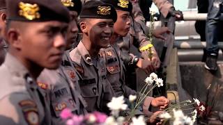 Flower power: Students in Jakarta hand out blossoms as sign of peaceful protests