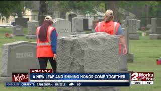 Women with disabilities clean veterans headstones