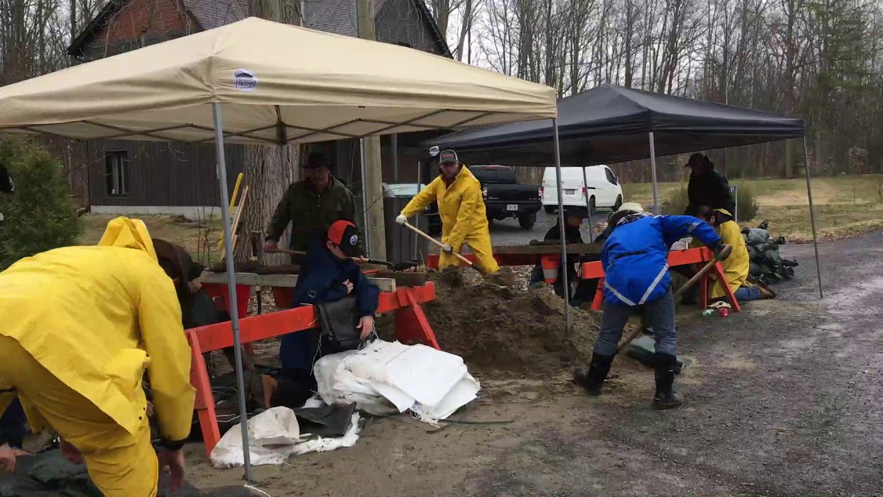 Volunteers filling sandbags in Cumberland, Friday April 26, 2019