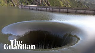 The water level in lake berryessa reservoir, 75 miles north of san
francisco, has risen so much that, unusually, is pouring into its
overflow pipe,...