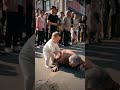 Grandma fell down, the understanding baby went forward to check and help grandma up.