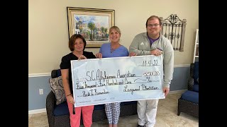 Orangeburg's Longwood Plantation and Magnolia Place Friday presented a $5,501 check to the South