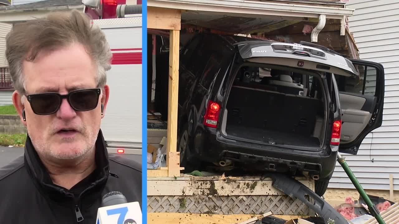 Neighbor reacts after car crashes into home - YouTube