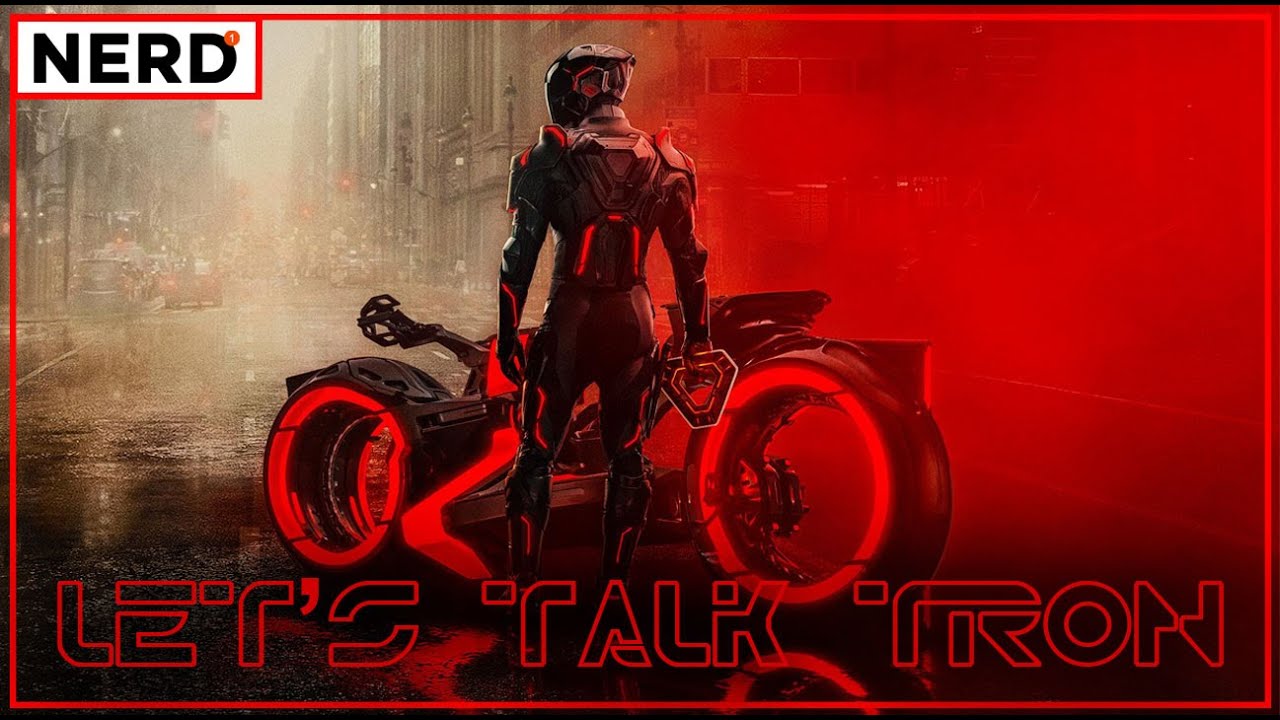 Tron Ares standing beside his light cycle