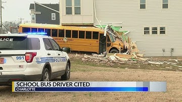 Driver cited after NC school bus crashes into building