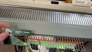Using slotted garter bar to turn stitches on an SK150
