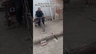 Using A Pedal Powered Mechanical System For Cutting Large Wooden Logs