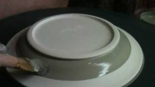 Brushing Glazes On The Potter's Wheel