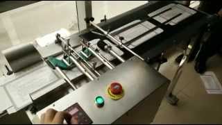 Arojet High-speed automatic paging machine on cartoon box.