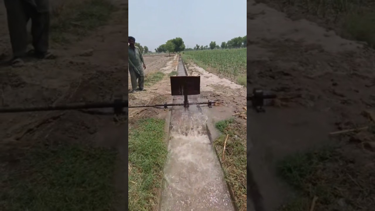 TRAKTÖRE TEKERİNE BAĞLANAN ALET İLE  KANALDAN SU AKTARMA İŞLEMİ