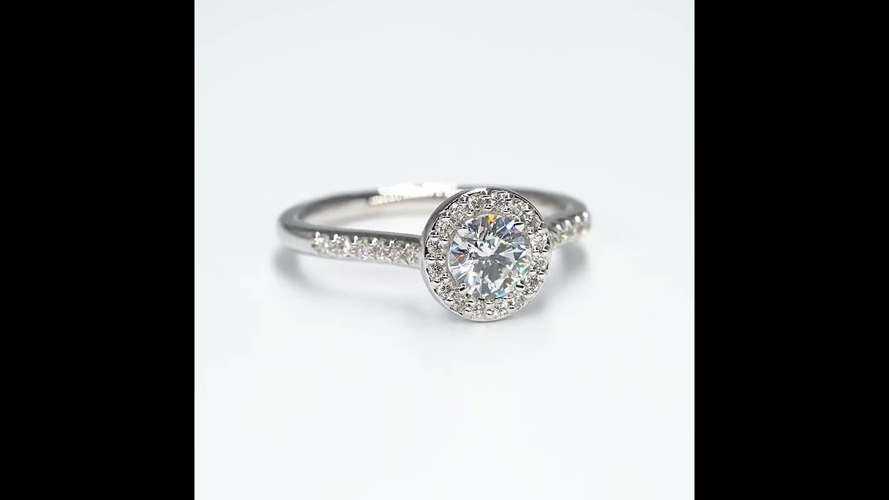 Bague solitaire or blanc diamant entourage diamants, corps empierré