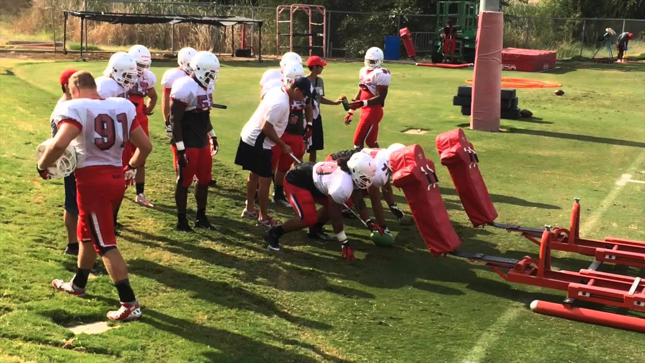 Fresno State defensive line drills as coach Peter Germano talks