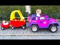 Little Gril Elis Plays Hide N Seek with Baby Dolls - Ride on Power Wheel Outdoor Activity