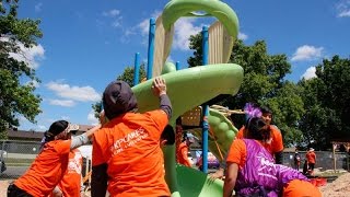 About a hundred Kaiser Permanente employees and physicians joined with other community volunteers to build a playground in an 