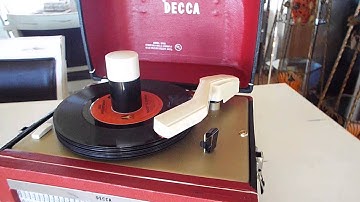 Decca 45 player playing a stack of record.
