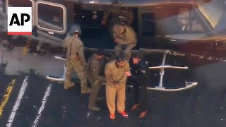 Authorities transfer handcuffed Maduro and his wife to New York Court