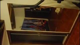 a girl doing striptease in the mirror