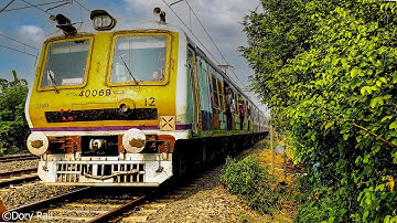 Aero dynamic Electric Multiple Unit local train fast and furious skipping through little curve