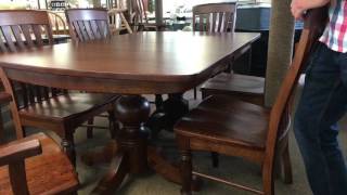 This Amish dining table with self storing leafs features a pulley system and a double pedestal base. With six wood options, over a 