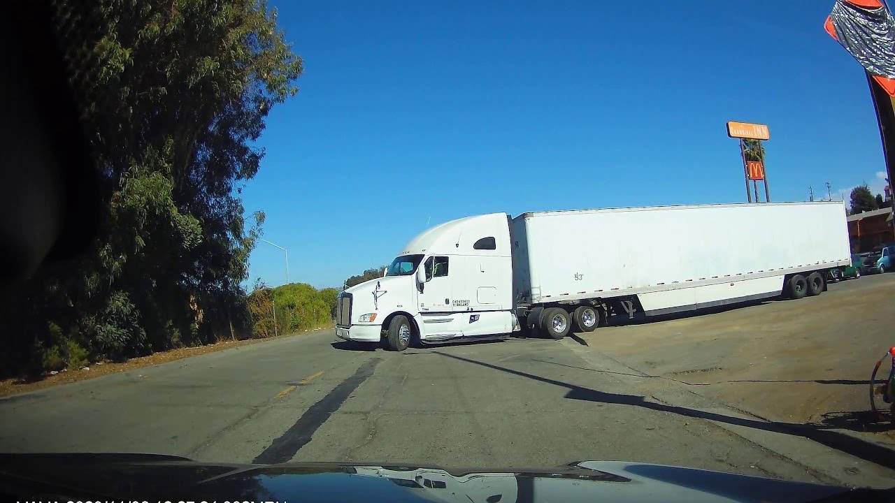 Semi Truck Gets High Centered Pulling into Street ViralHog YouTube