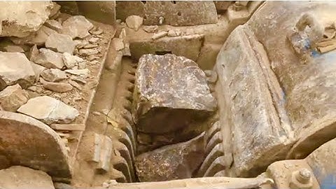 Stone Crusher Machine: A Giant at Work"The Power of Stone: Machine Working in Action#rockcrusher!