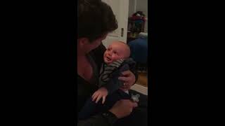 Baby Laughs at Mom Putting Pacifier in Mouth - 985799