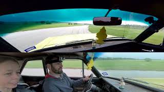 Driving A 1965 Ford Falcon Around A Racetrack In The Rain